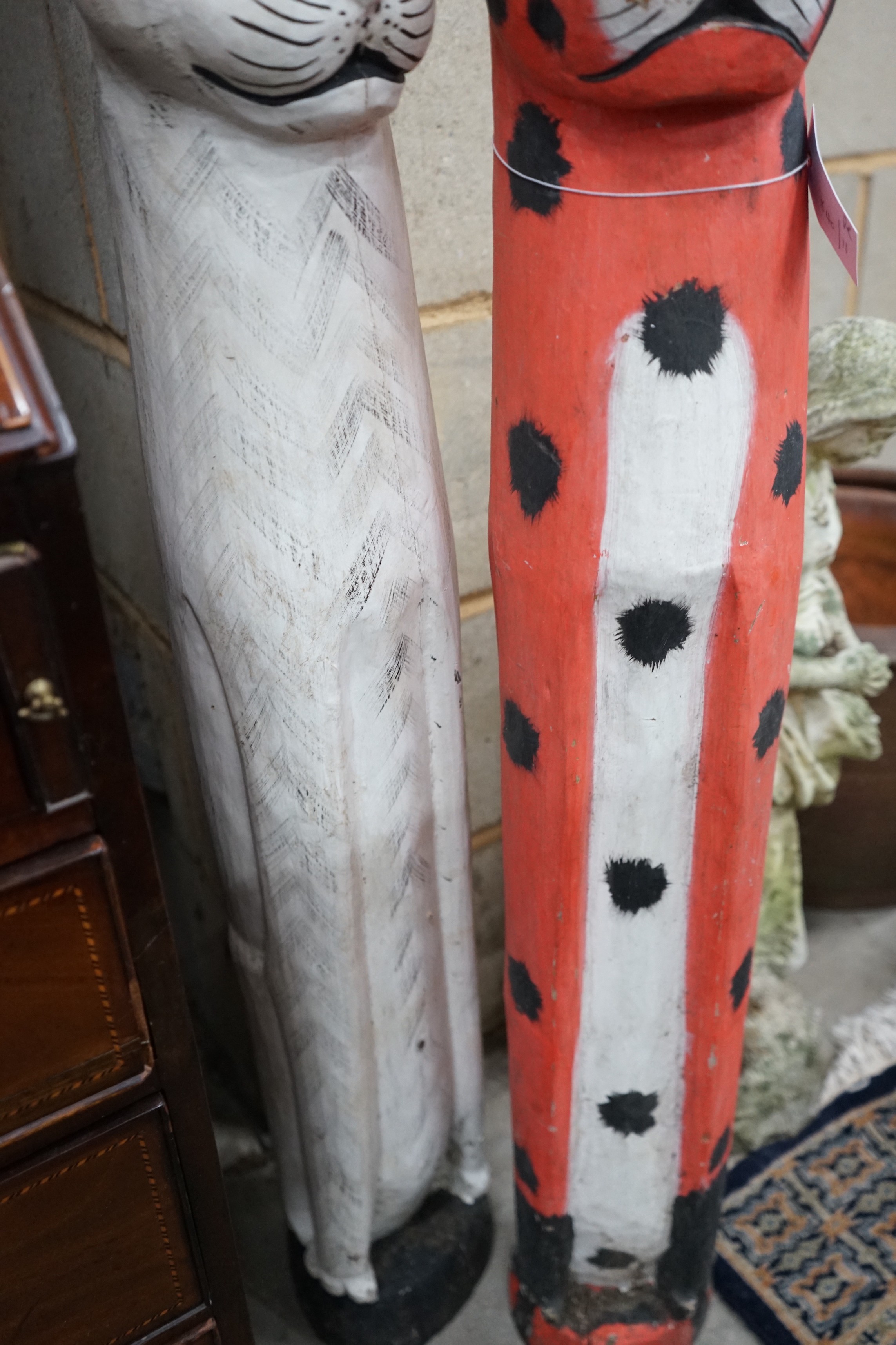 A pair of painted carved wood cats, height 100cm
